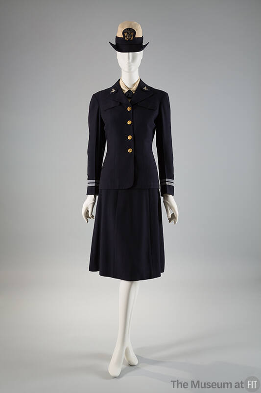 Navy blue uniform suit with brass buttons, light blue trim on sleeves, matching knee length str…