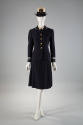 Navy blue uniform suit with brass buttons, light blue trim on sleeves, matching knee length str…