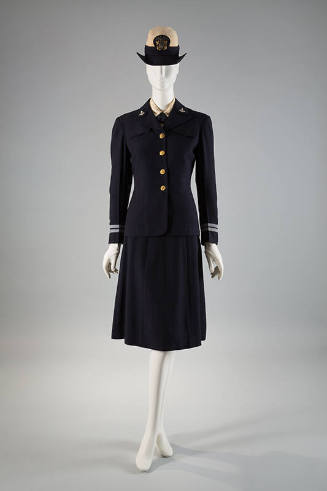 Navy blue uniform suit with brass buttons, light blue trim on sleeves, matching knee length str…