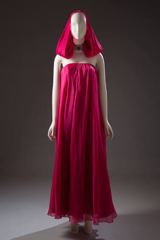 Fuchsia pink strapless floor length evening gown with matching hood tucked into rhinestone neck…