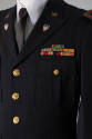 Four button navy blue jacket with military pins 