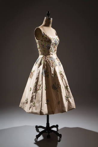 Off-white silk sleeveless dress with embroidered pink, green, blue and brown floral design, to-…