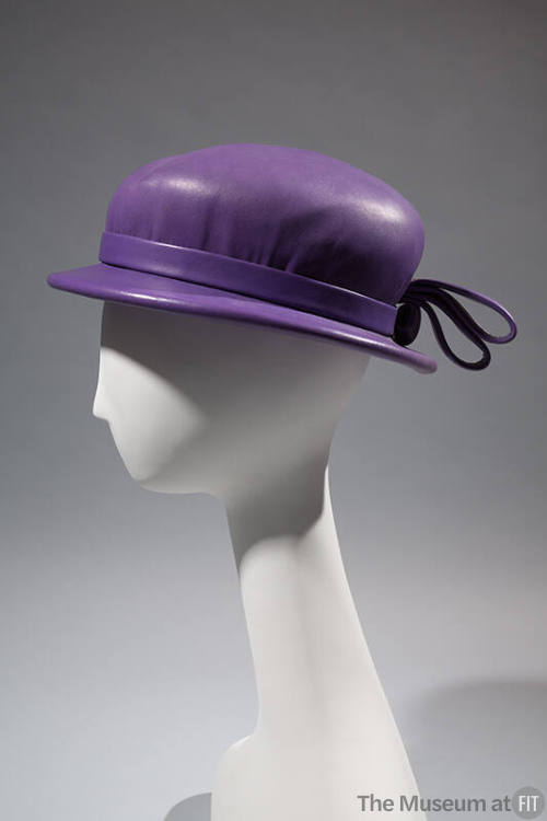 Purple leather hat with shallow brim and bow at back