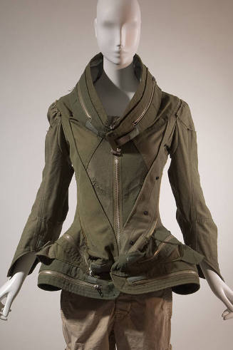Army green pieced jacket with oversize stand collar, sculpted peplum and front zipper closure w…