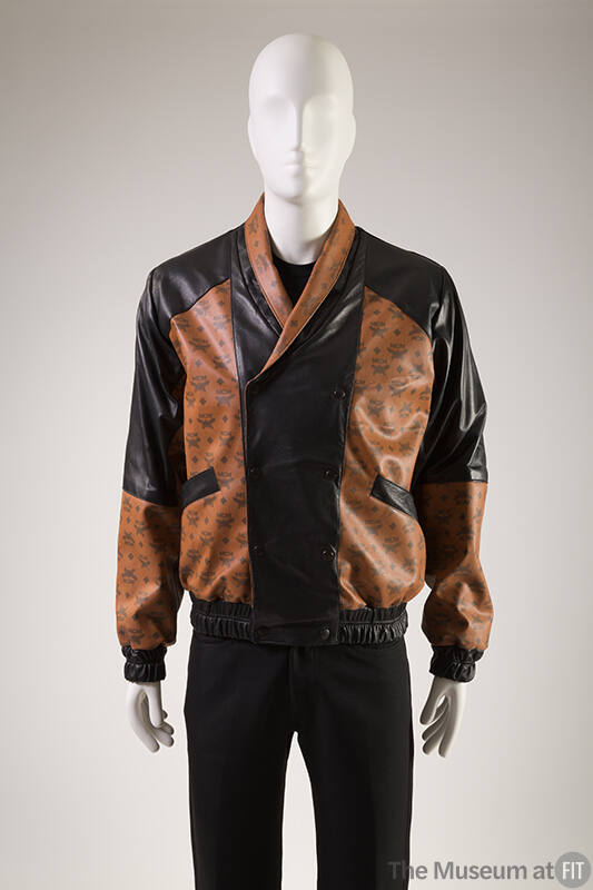 Brown oversize bomberstyle jacket with black MCM logo print and black panels at front and back …