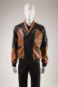 Brown oversize bomberstyle jacket with black MCM logo print and black panels at front and back …