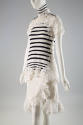Lace trimmed white short sleeve turtleneck top with navy blue stripes and white knee length wra…