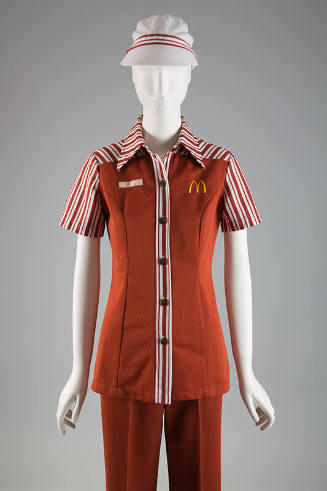 Brown McDonald’s uniform of short sleeve button front shirt with white striped trim, M logo on …