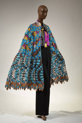 Blue and brown cotton and lace cape over black, white, purple and yellow polka dot blouse and b…