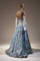Back view of blue, lavender and white ballgown showing low cut back and full skirt with train