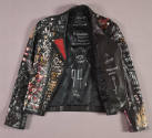Alternate view of black leather jacket lying flat showing drawings on lining of abstract Americ…