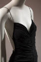 Detail of black sleeveless ruched jumpsuit with spaghetti straps