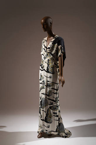 Off-white floor length dress printed with gray stones with black shadows and yellow symbols, V-…