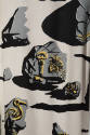Detail of off-white dress printed with gray stones with black shadows and yellow key, bee, and …