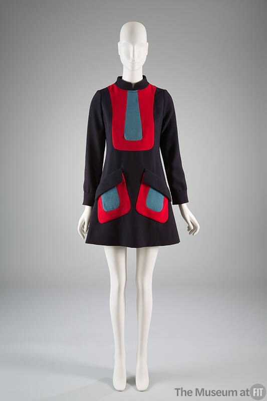 Navy blue A-line dress, with contrasting red U shaped inserts filled in with light blue and lon…