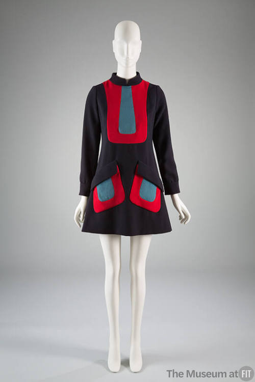 Navy blue A-line dress, with contrasting red U shaped inserts filled in with light blue and lon…