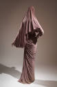 Back view of light purple evening dress showing capelet and asymmetrical draping and shirring i…