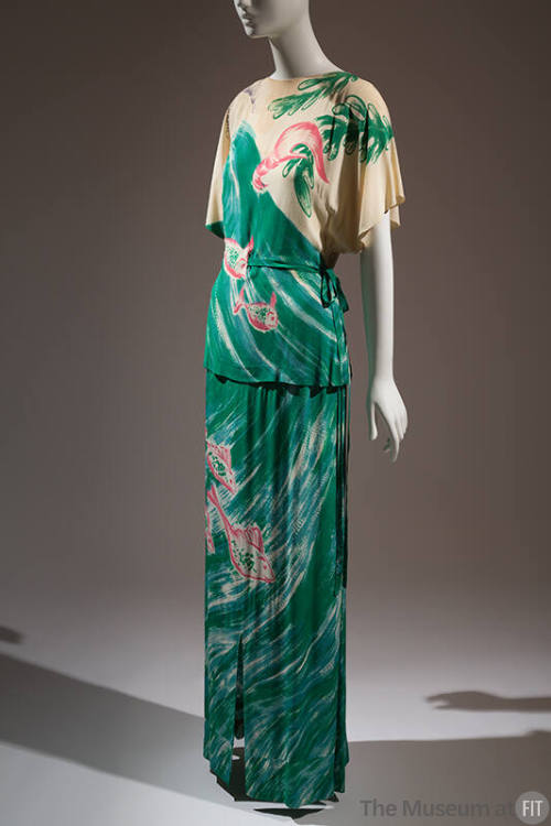 Two-piece dress of belted tunic and floor-length skirt with large scale design of ocean waves, …