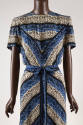 Detail view of white, black and blue printed dress bodice with short sleeves and matching self …