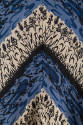 Detail view of dress print showing alternating stripes of white and black linear plants and blu…