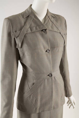 Gray / orange check jacket with overlapping decorative fabric strips