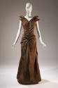 Brown/green floor length evening dress with pointed cap sleeves, center buttons and belt at wai…