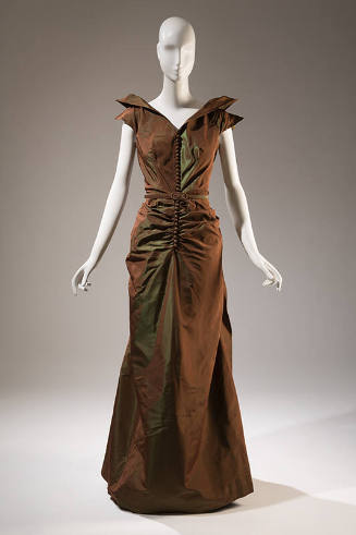 Brown/green floor length evening dress with pointed cap sleeves, center buttons and belt at wai…