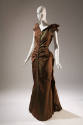 3/4 view of brown/green evening dress showing small bustle and train