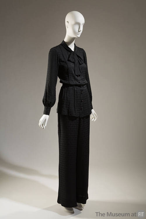 Black blouse with tied bow at neckline and matching pants