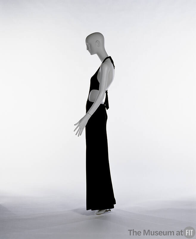 Side view of black halter jumpsuit with side cutouts
