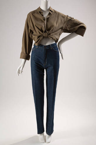 Dark blue denim jeans styled with brown button down top tied at waist