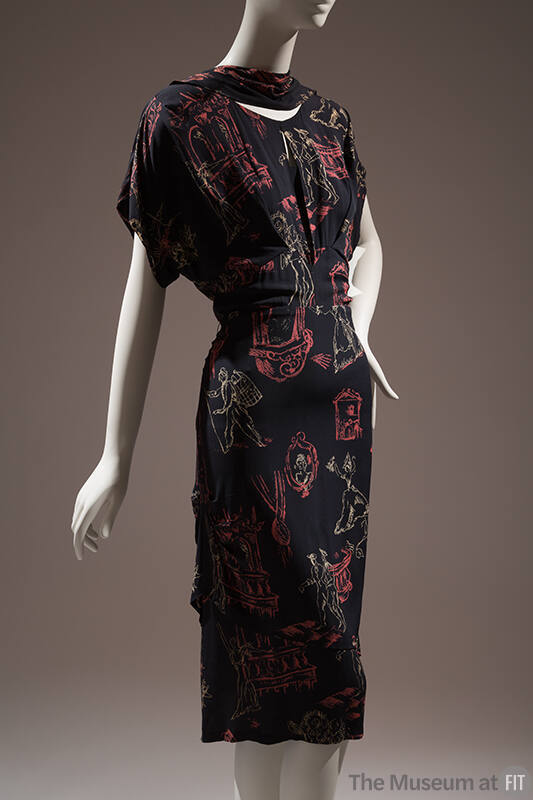 Calf length dress in black, cream and rose print of sketched figures, flowers and architectural…