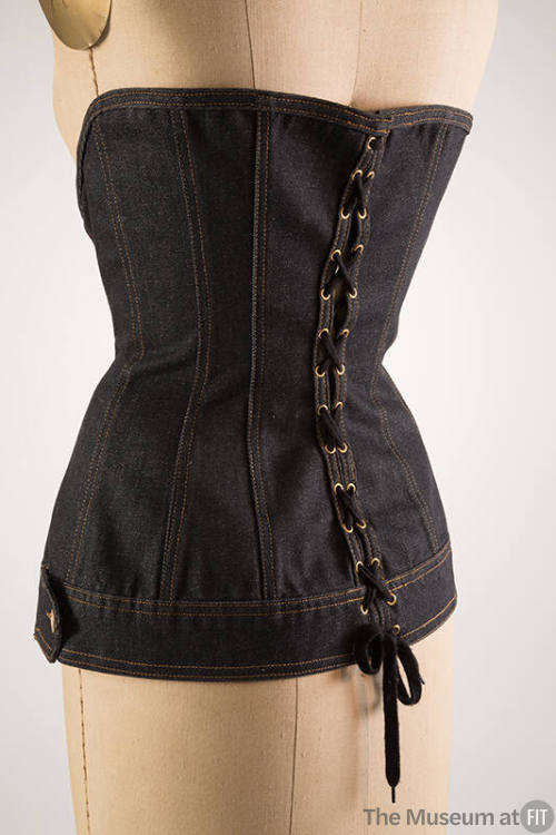 Back of blue denim corset with lacing 