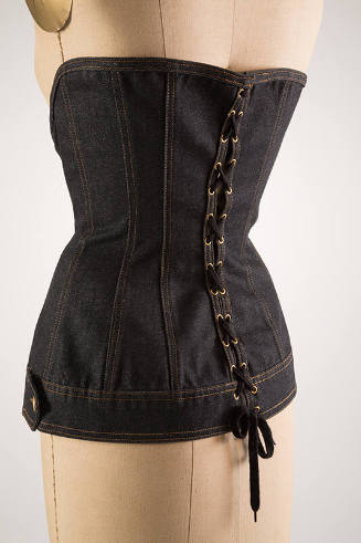 Back of blue denim corset with lacing 