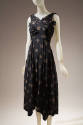 Black silk wrapped bodice sleeveless dress with allover beige YY monogram and cross designs, be…