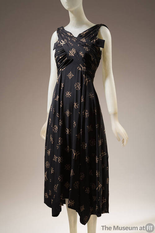 Black silk wrapped bodice sleeveless dress with allover beige YY monogram and cross designs, be…