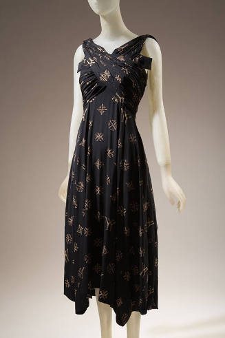 Black silk wrapped bodice sleeveless dress with allover beige YY monogram and cross designs, be…
