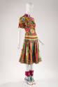 Multicolor patchwork top with ruffled capelet and appliques, multicolor striped silk skirt with…