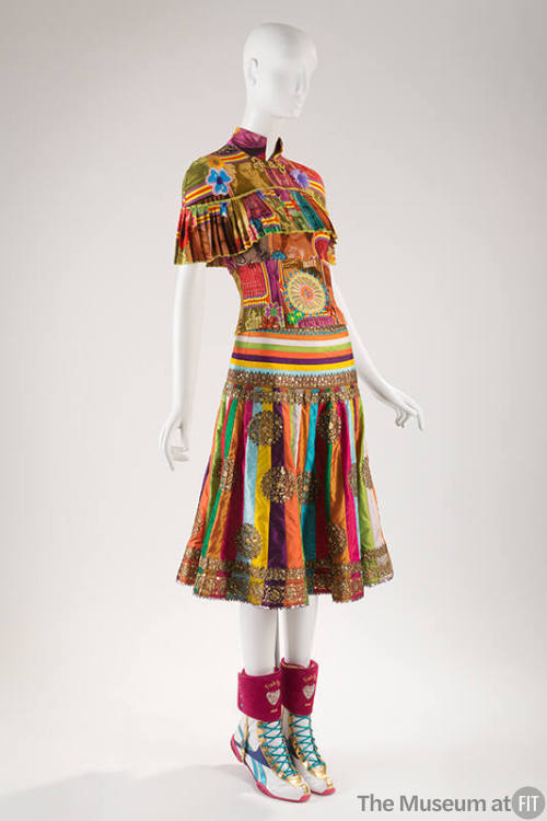 Multicolor patchwork top with ruffled capelet and appliques, multicolor striped silk skirt with…