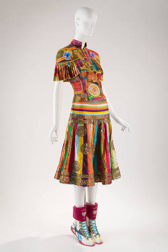 Multicolor patchwork top with ruffled capelet and appliques, multicolor striped silk skirt with…