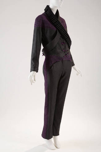 Grey and black striped pantsuit with purple applique across shoulders and down sides of pant le…