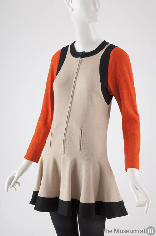 Ivory mini dress with black hem band and orange long sleeves