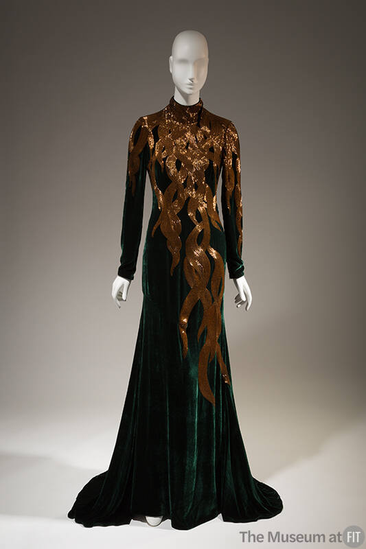 Dark green velvet long sleeve eveing gown with gold beads in falling hair tresses patten from n…