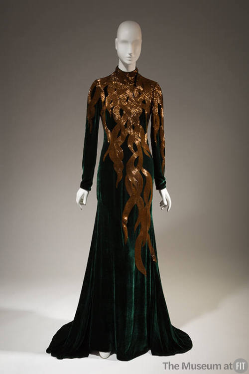 Dark green velvet long sleeve eveing gown with gold beads in falling hair tresses patten from n…