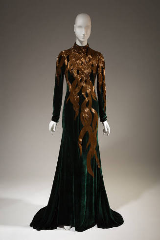 Dark green velvet long sleeve eveing gown with gold beads in falling hair tresses patten from n…