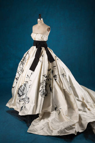 Ivory strapless ball gown with black, large scale painted roses; attached black belt with large…