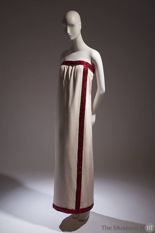 Ivory strapless floor length evening dress with deep red beaded and embroidered edge band at ne…