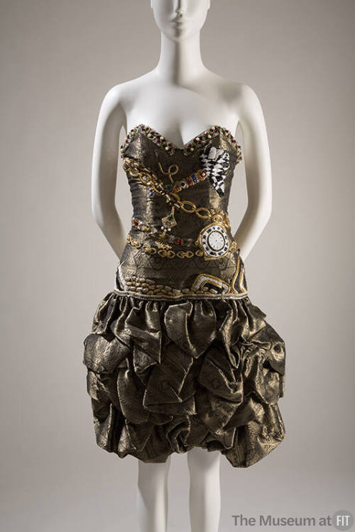 Black and tarnished metallic gold strapless evening dress with floral and geometric horizontal …