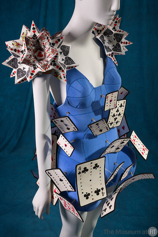 Royal blue sleeveless mini dress with playing cards of various sizes attached on springs and sp…