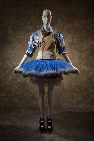 Tan leather motorcycle jacket with blue and white faux feather sleeves, flared blue tutu skirt …